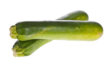 zucchinis or courgettes isolated on a white background.