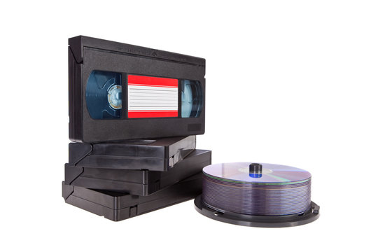 Old Video Cassette tapes with a DVD disc isolated