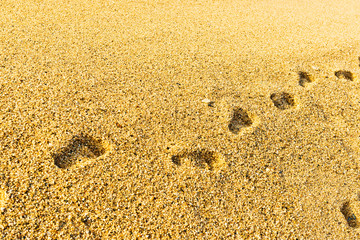 Footprint on sand with foam