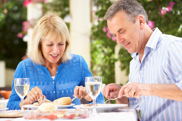 Senior Couple Enjoying Meal outdoorss