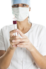 Doctor with blood in the syringe