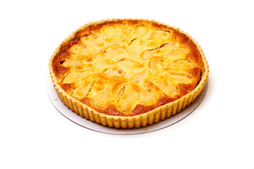 Pear and frangipane tart isolated on a white stuido background.