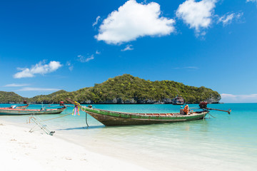 Fototapeta na wymiar Long Tail Boat in Clear Water and Blue sky. Samui Island, Thaila