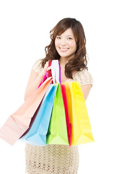 Beautiful shopping woman on white background. Portrait of asian.
