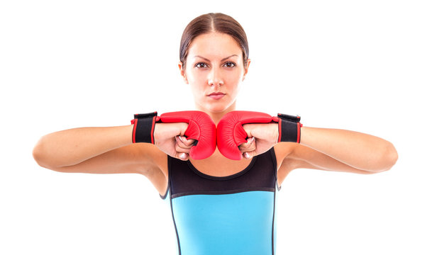 Pretty girl in boxing gloves pose, isolated on white