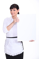 Waitress holding up a blank sign