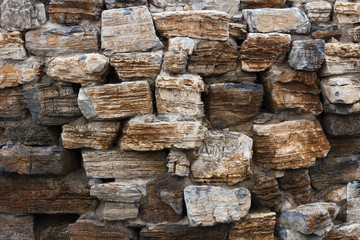 Wall built of rough natural stone