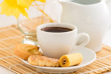 Coffee cup and different kinds of cookies