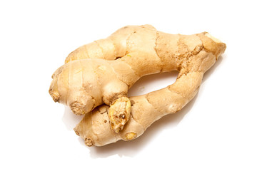 Root ginger isolated on a white studio background.
