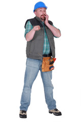 craftsman pointing at something and looking guilty