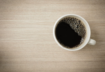 Fresh Black Coffee in a White Ceramic Cup