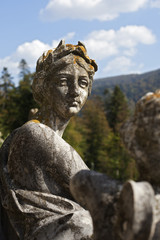 stone statues decorating peles castle gardens