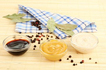 various sauces on bamboo mat