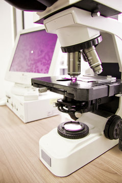 Microscope Analyzing Cells In A Blood Sample