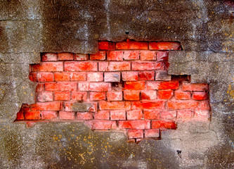 Damaged plaster on brick wall
