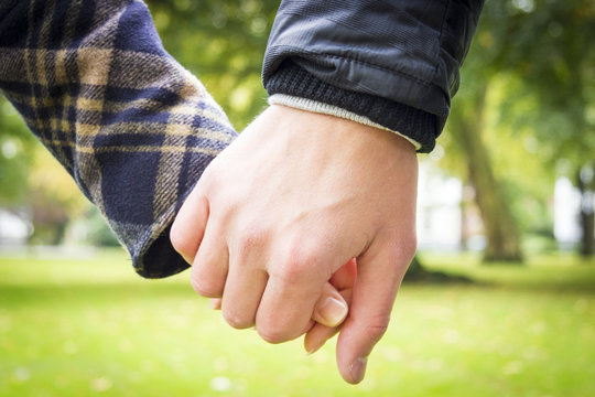 Concept shot of friendship and love of man and woman: two hands