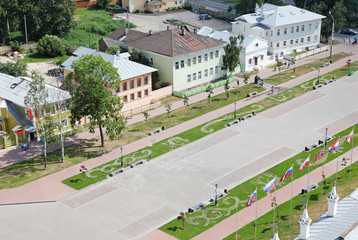 Kremlin square with houses, flags, lawns in Vologda