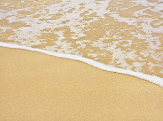 Beach and sea with foam line