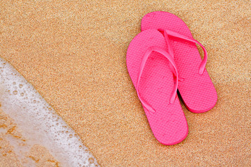 Summer vacation background flip flops on beach