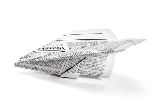 paper plane from newspaper isolated on white