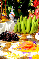 Fototapeta premium Banana, grape and Thai sweets displayed on tray with pedestal.