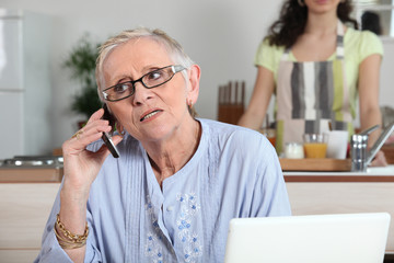Elderly woman chatting on the phone