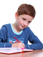 beautiful little boy sitting at the table