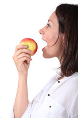 Woman eating an apple