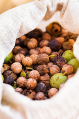 Jute bag filled with fresh walnuts