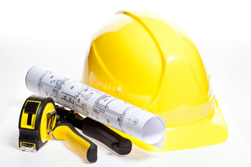 Hardhat, construction tools and blueprint