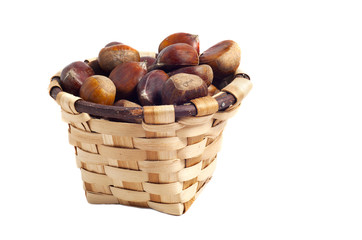 basket of chestnuts, autumn fruits, isolated on white