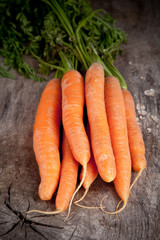 Fresh carrots on wooden table