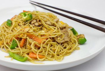 Chinese style fried yellow noodles with minced pork and vegetables