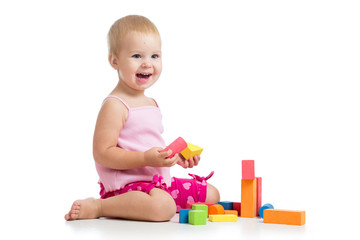 Happy kid playing toy blocks  isolated on white background