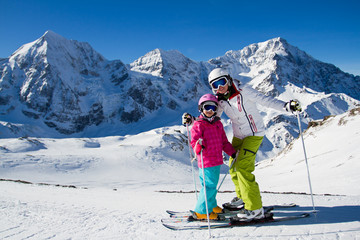 Skiing, winter sports - skiers on mountainside
