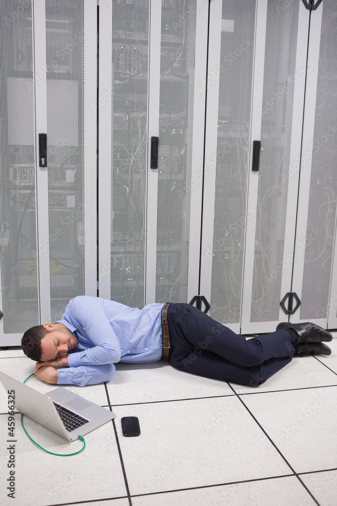 Poster Man napping in data center