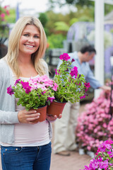 Fototapeta premium Customer carrying flowers