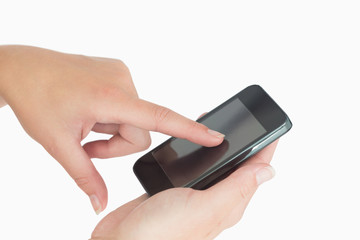 Hand touching a smartphone