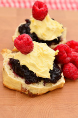 Raspberry scones with jam and cream