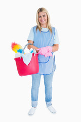 Smiling maid holding a pink bucket
