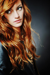 Fototapeta premium Portrait of woman model with shiny long hair
