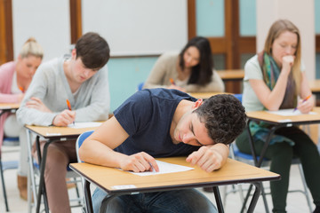 Man sleeping in exam hall