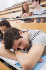 Student sleeping at the lecture hall