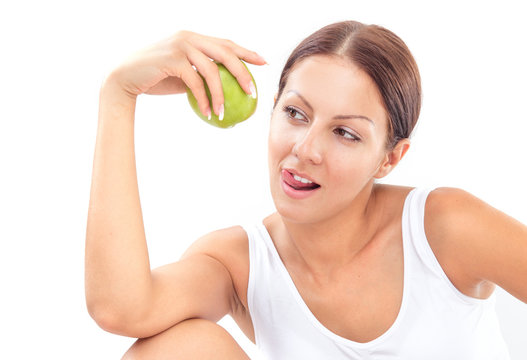Pretty woman with apple on white background