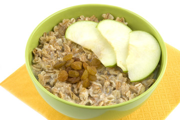 Bowl of oatmeal porridge isolated on white