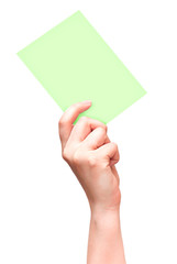 Female hand with empty light green card isolated on white
