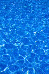 Blue tiels pool with ripple water reflection