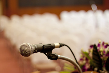 Close up of microphone in concert hall or conference room