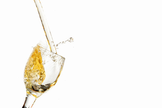 White wine pouring into glass