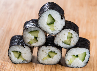 Heap of Maki Rolls on wood